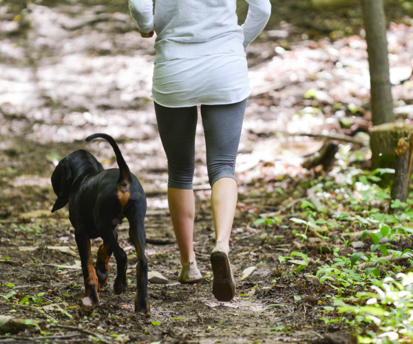 woman running with dog